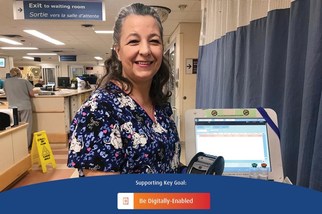 A registered nurse at Health Sciences North displays MobiLab, a handheld device used by laboratory technicians, in the Emergency Department.